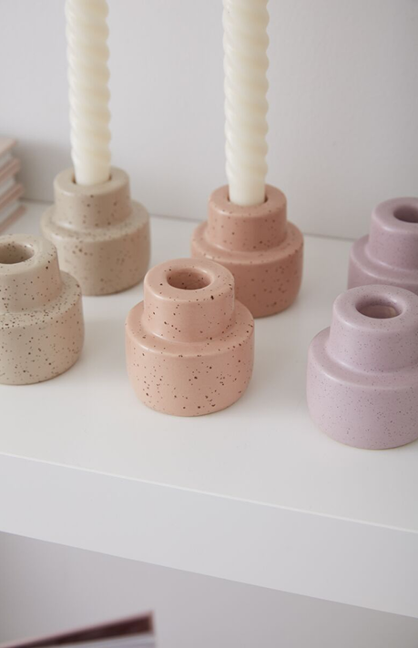 Set of speckled ceramic candleholders in peach, beige, and lavender tones for elegant home decor accents