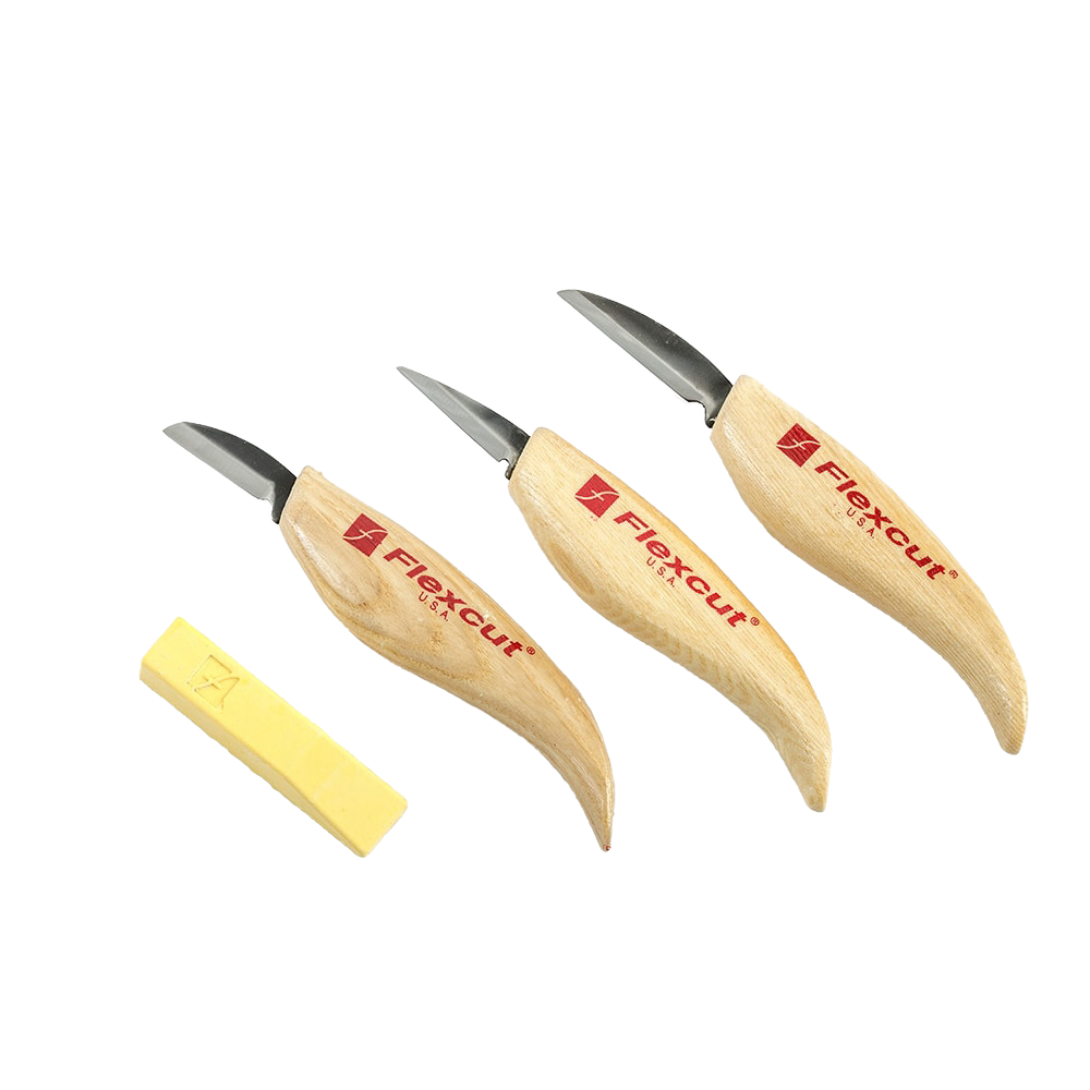 Set of three ergonomic wood-handled carving knives with sharp steel blades and a block of yellow sharpening compound for woodworking tools.