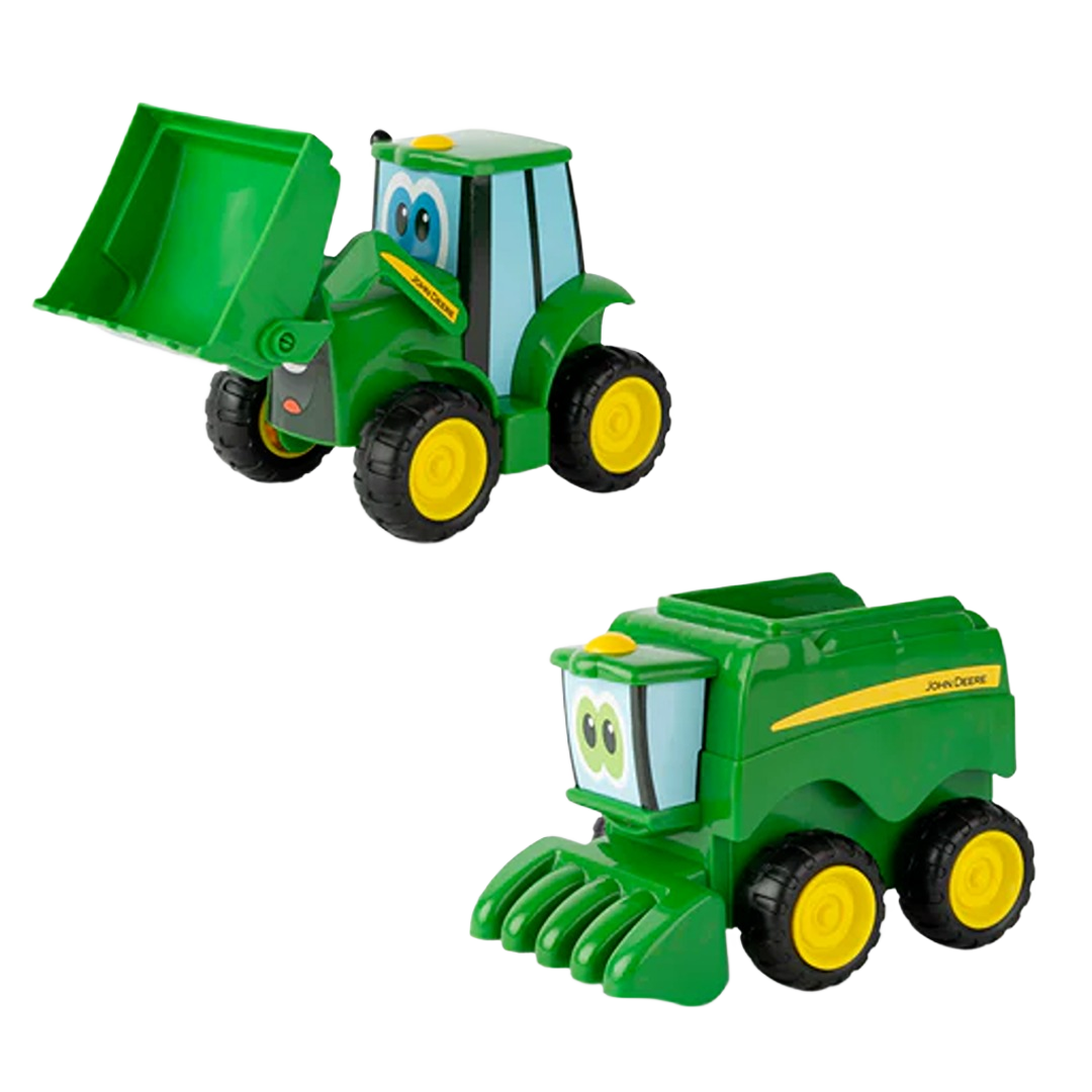 Green toy tractor with front loader and green toy combine harvester with yellow wheels for children's play