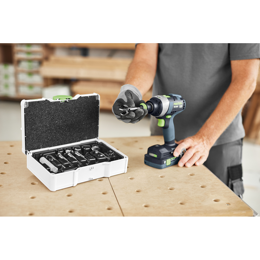 Set of Forstner drill bits and a cordless drill in a woodworking workshop setting for tool accessories and home improvement.