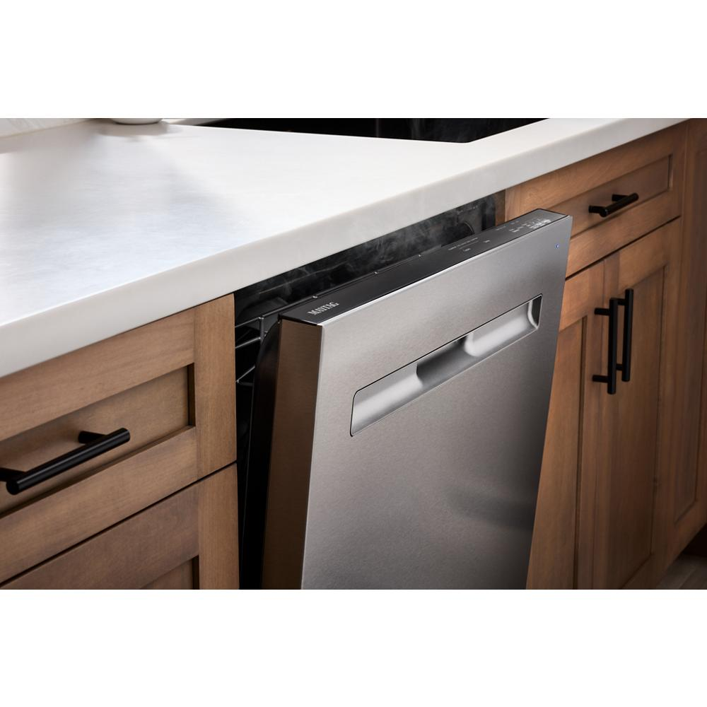 Partially open stainless steel top control dishwasher in kitchen cabinetry, featured in dishwashers collection