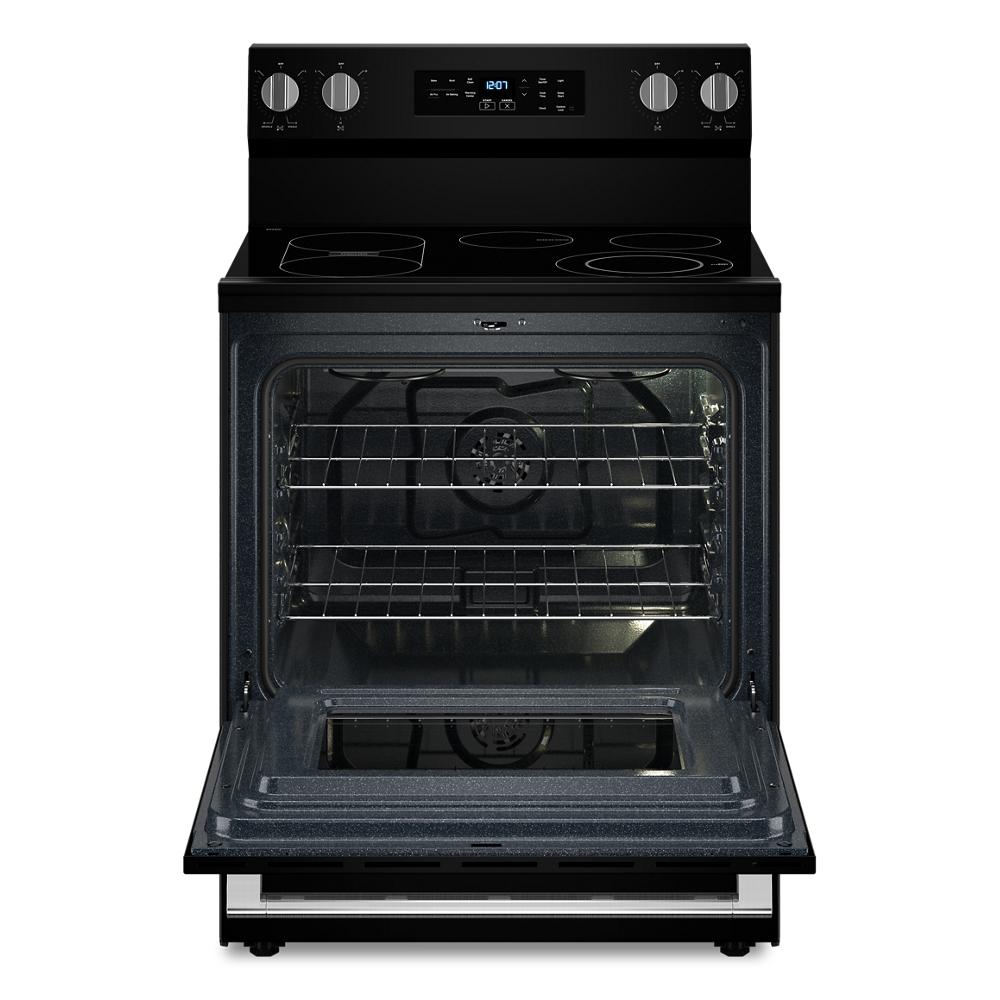 Black electric range with smooth cooktop, digital controls, and oven door open revealing multiple racks and interior fan