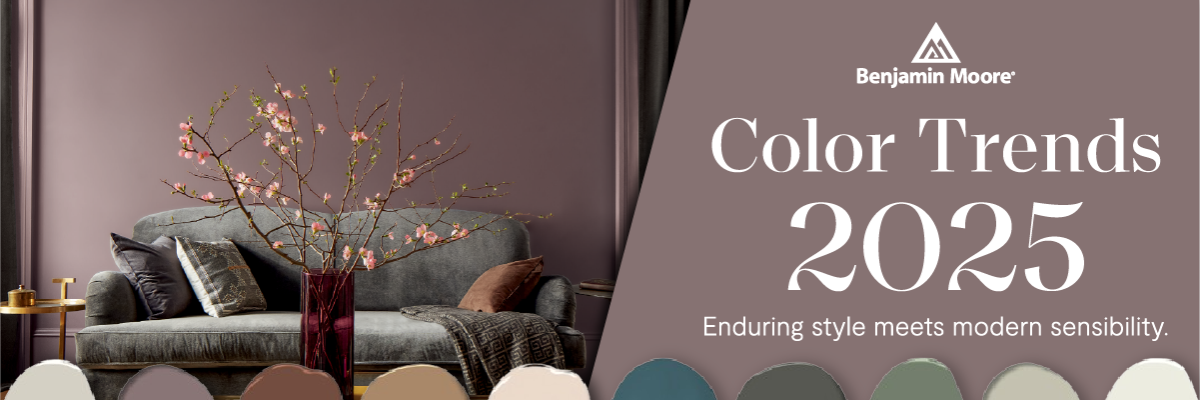 Living room setup with a gray sofa, throw pillows, and a glass vase holding flowering branches, accompanied by a palette of muted paint colors and text about 2025 color trends.