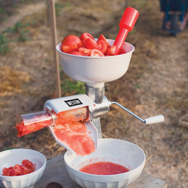 Manual tomato press with white and red parts, included in Small Kitchen Appliances and Kitchen & Kitchenware collections