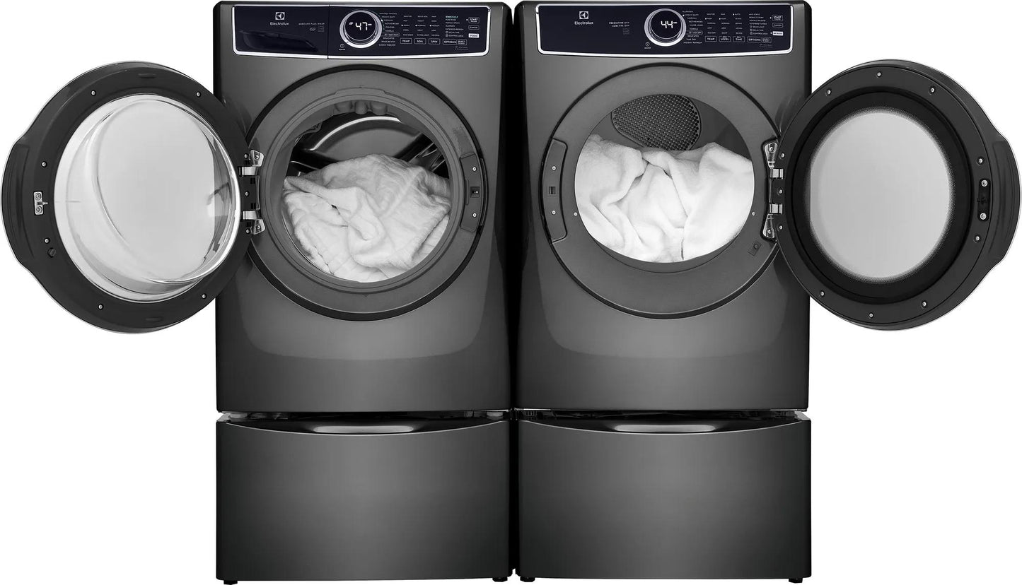 Dark gray front load washer and dryer pair with open doors and white laundry inside in modern appliances collection