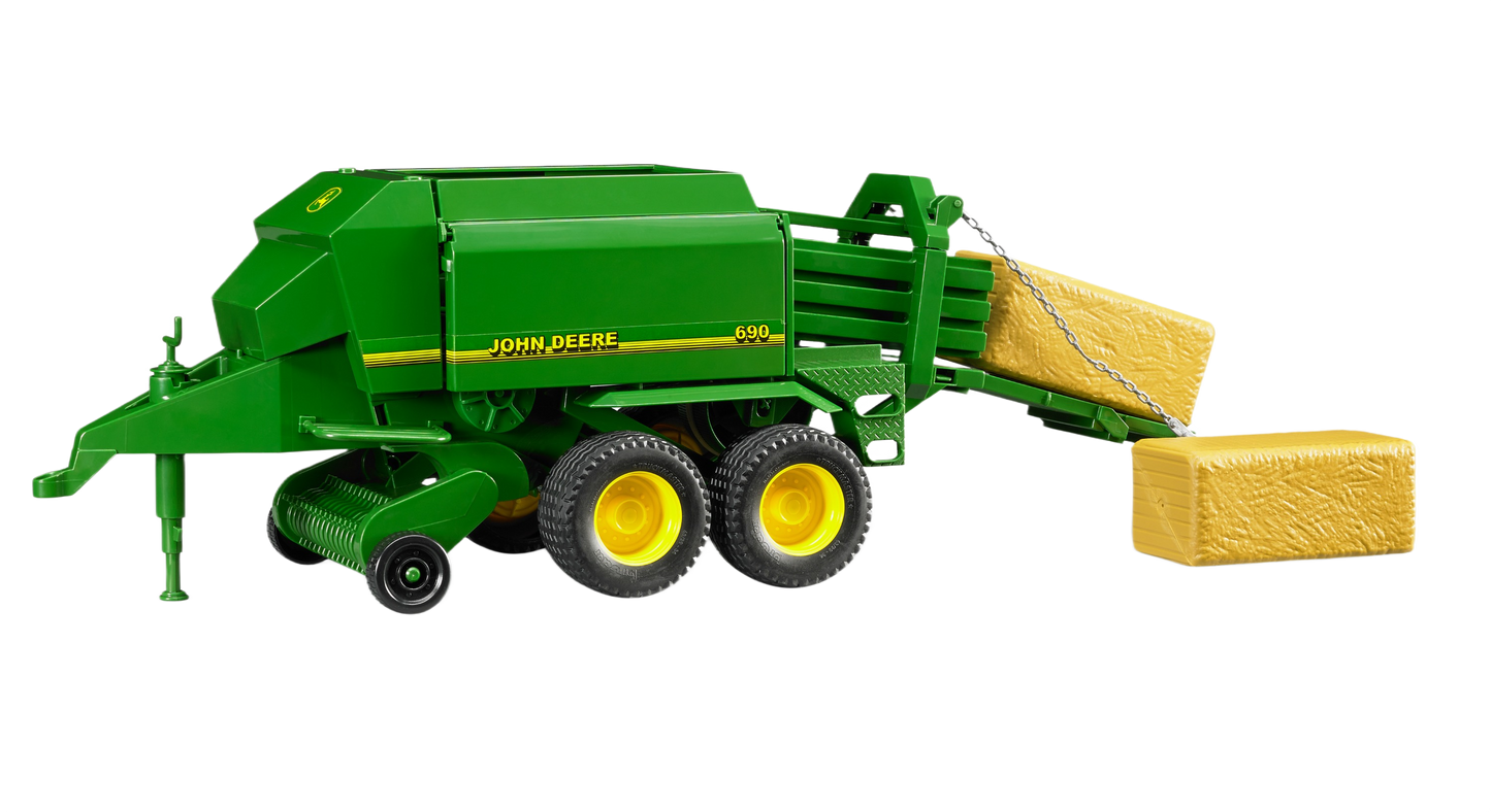 Green Bruder John Deere baler toy with yellow wheels and two detailed rectangular hay bales in Toys & Games collection