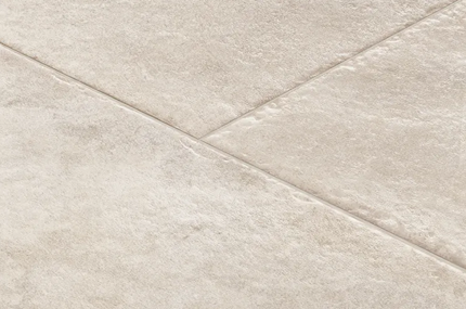 Beige luxury vinyl tile with a rigid canvas texture and subtle variation for home improvement flooring projects