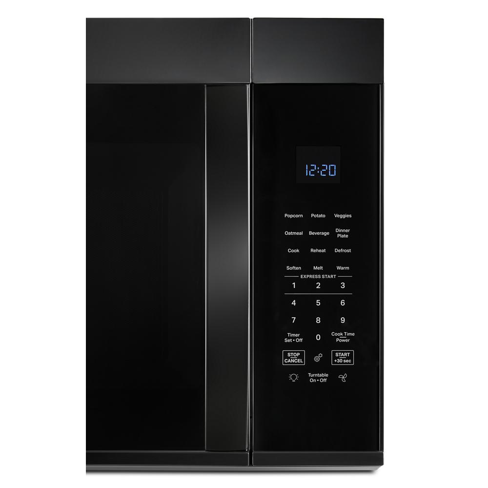 Black over the range microwave with digital display and touch control panel in kitchen appliances and home improvement setting