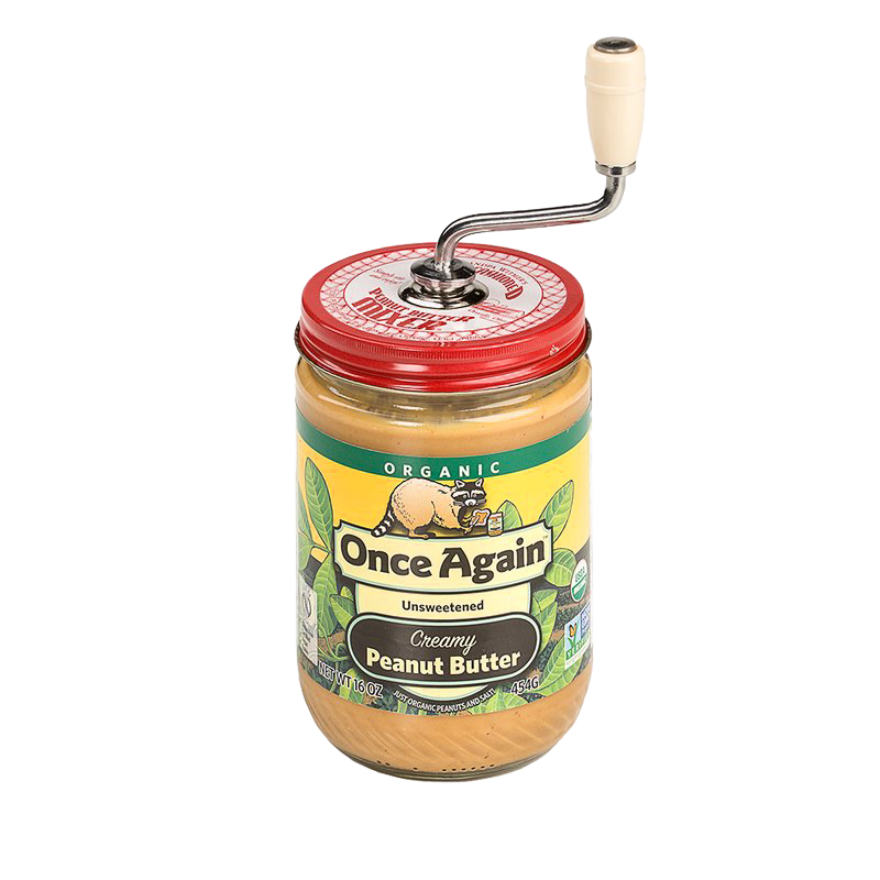 Red-topped old fashioned peanut butter stirrer with white handle on a jar of organic creamy peanut butter in Kitchenware collection
