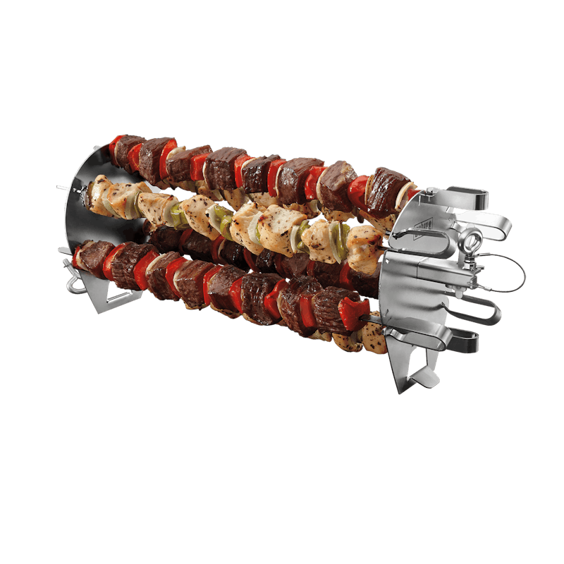 Six stainless steel skewers loaded with seasoned meat and vegetables on a rotisserie skewer set for grilling tasks