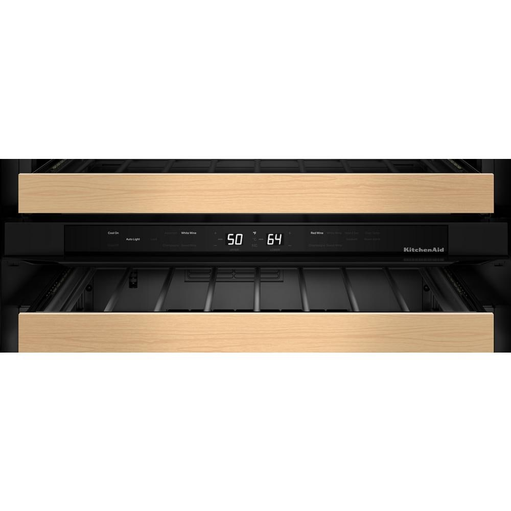 Control panel close-up of KitchenAid beverage center with black display and light wood-front racks in mini refrigerator collection
