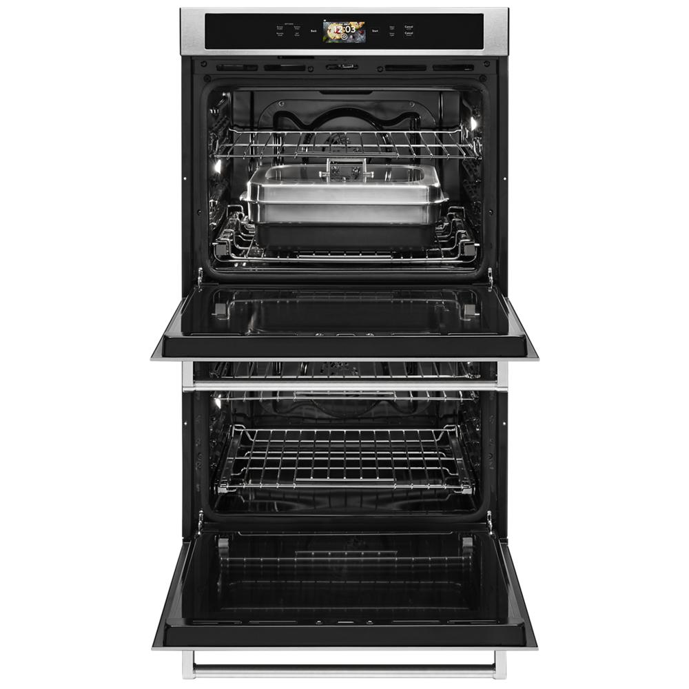 Open stainless steel smart double oven with digital display, baking pan inside, from KitchenAid wall ovens collection