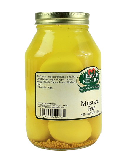 Glass jar of Hartville Kitchen Old Fashioned Mustard Eggs with bright yellow pickled eggs and mustard seeds inside