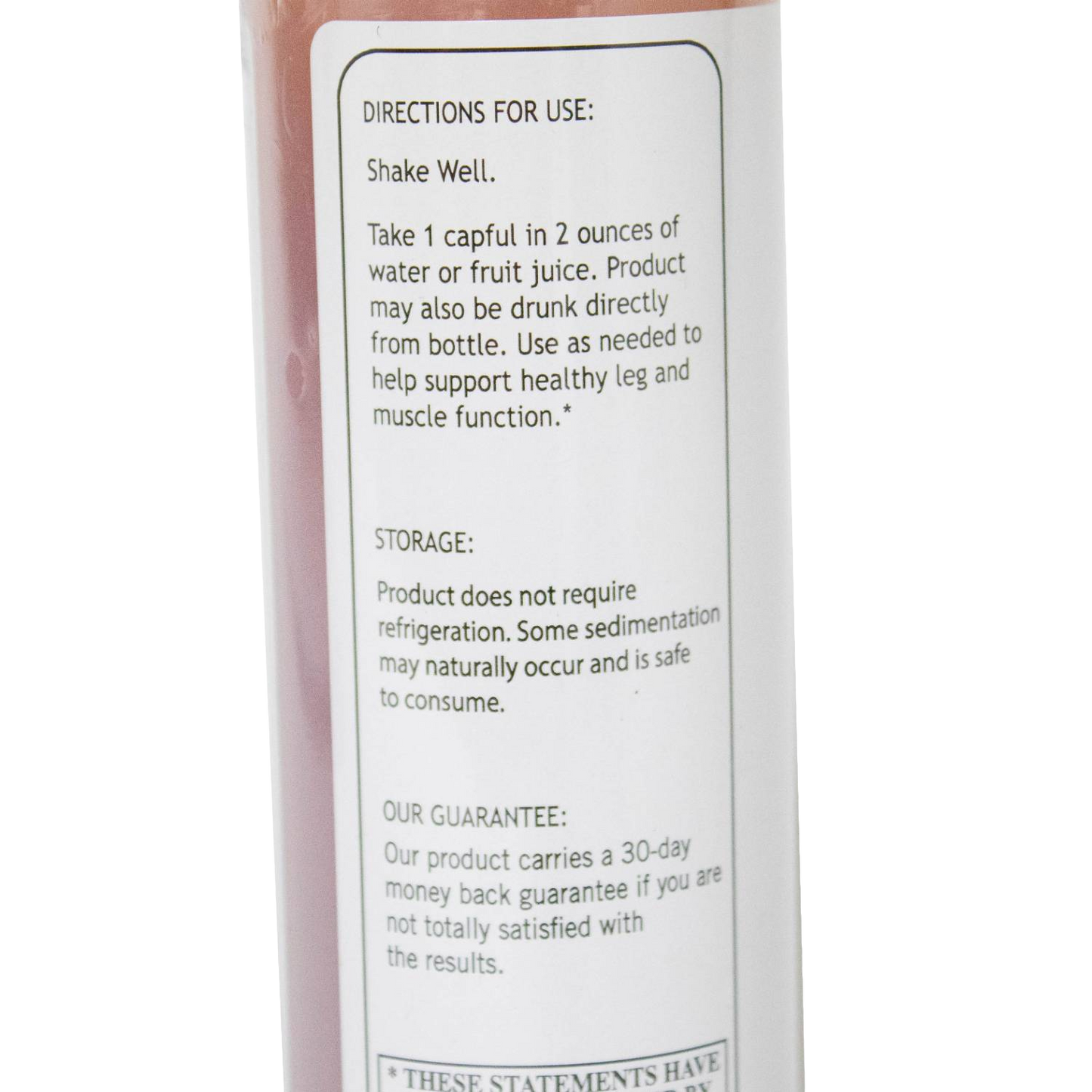 Close-up of a product label showing directions, storage, and guarantee details from a health and beauty tonic bottle.