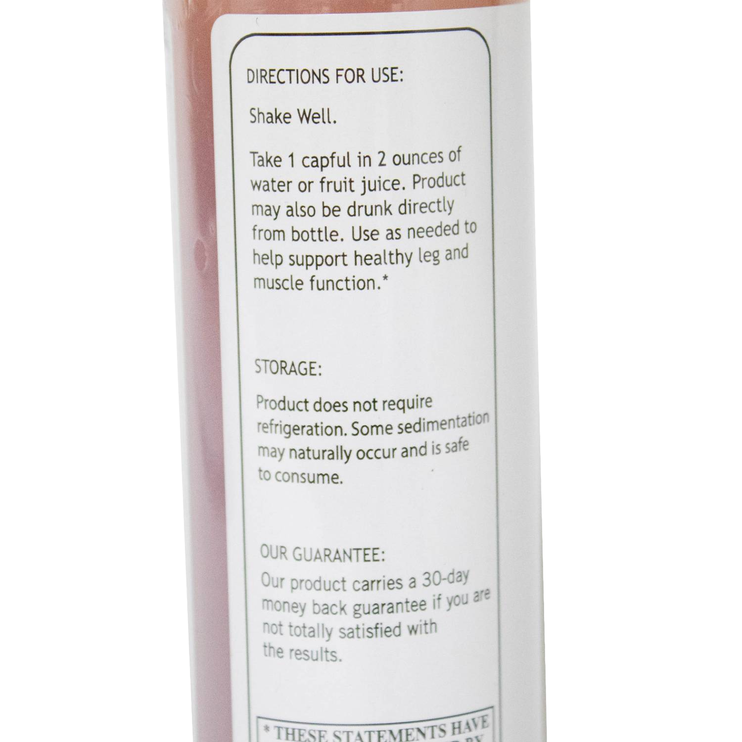 Close-up of a product label showing directions, storage, and guarantee details from a health and beauty tonic bottle.