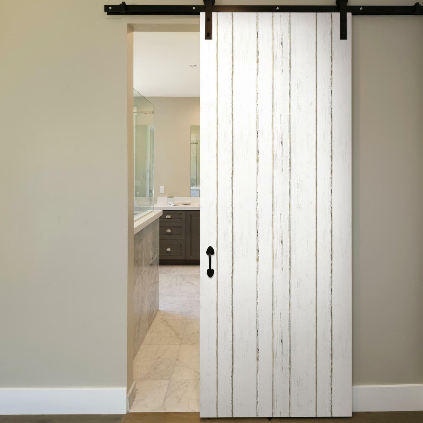 Sliding barn door with white lined shiplap peel and stick wallpaper in modern home decor setting