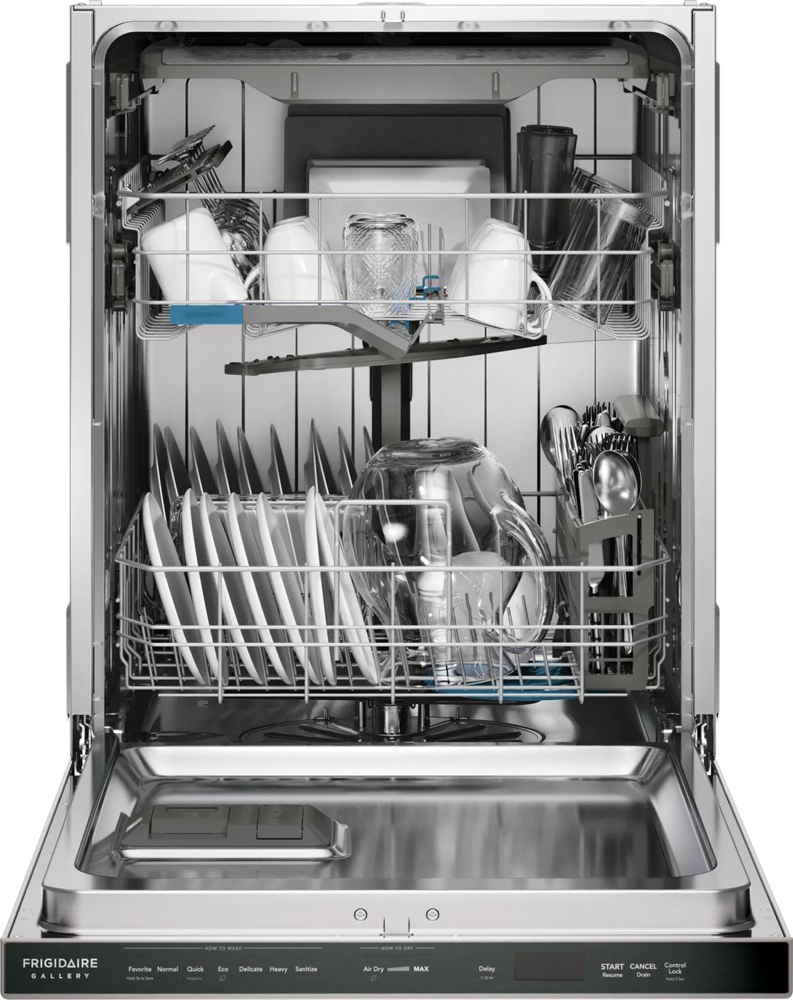 Open stainless steel tub dishwasher loaded with dishes, glassware, and utensils in kitchen appliances collection