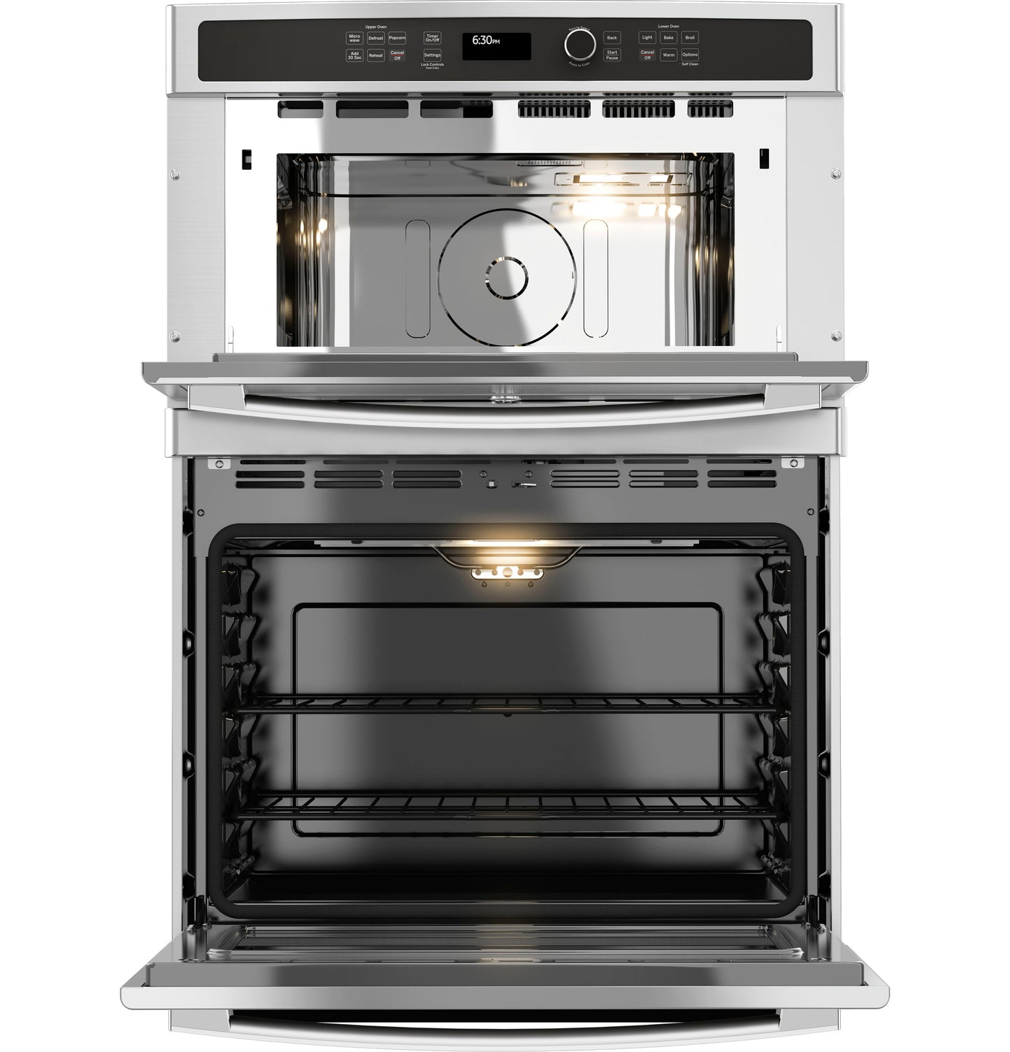 Open stainless steel combination double wall oven with illuminated interior and control panel in modern kitchen appliances collection
