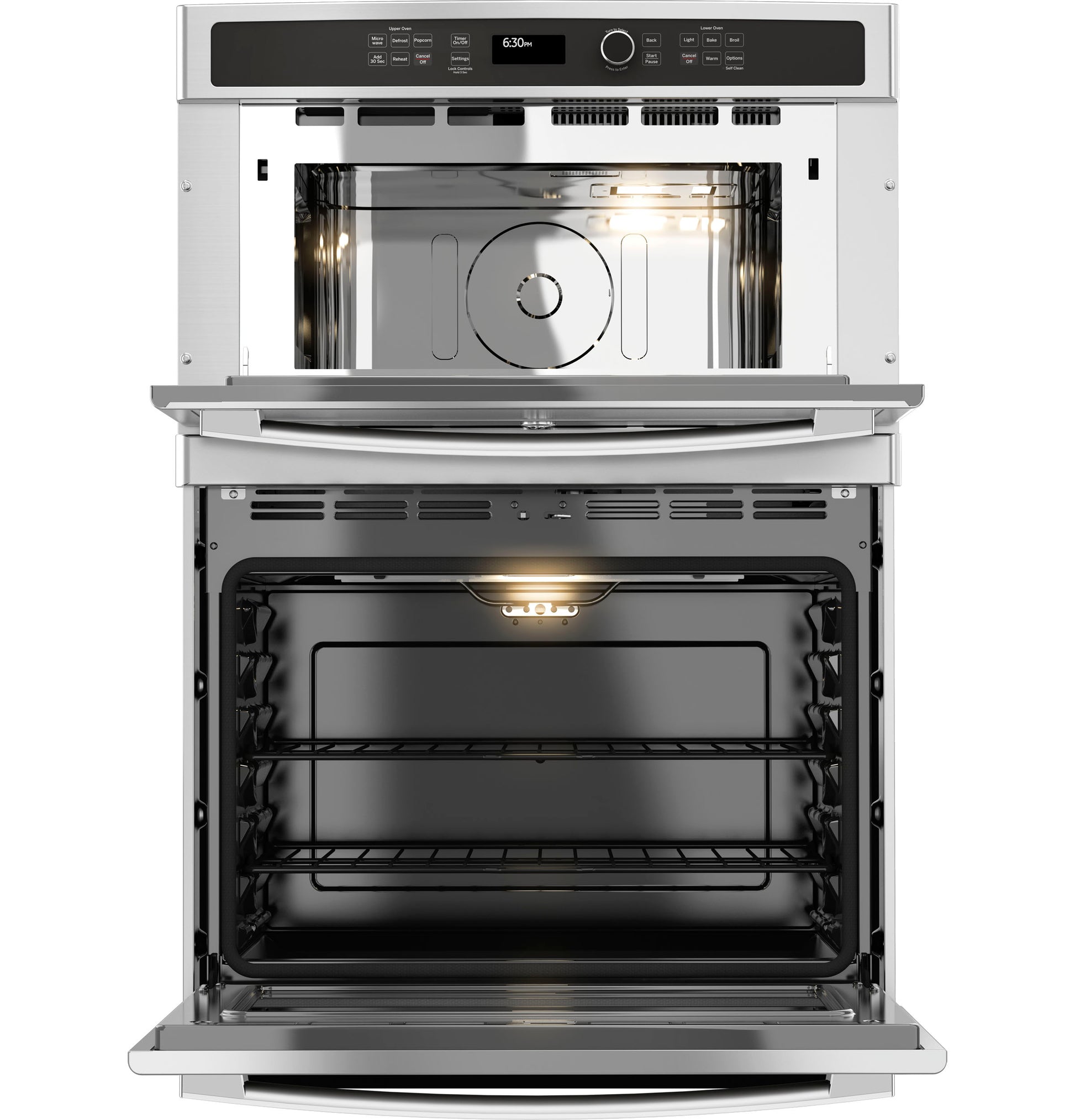 Open stainless steel combination double wall oven with illuminated interior and control panel in modern kitchen appliances collection