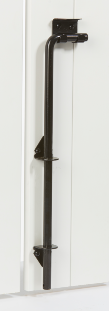 Black adjustable throw cane bolt mounted on white door for secure gate and door hardware installation in home improvement collections