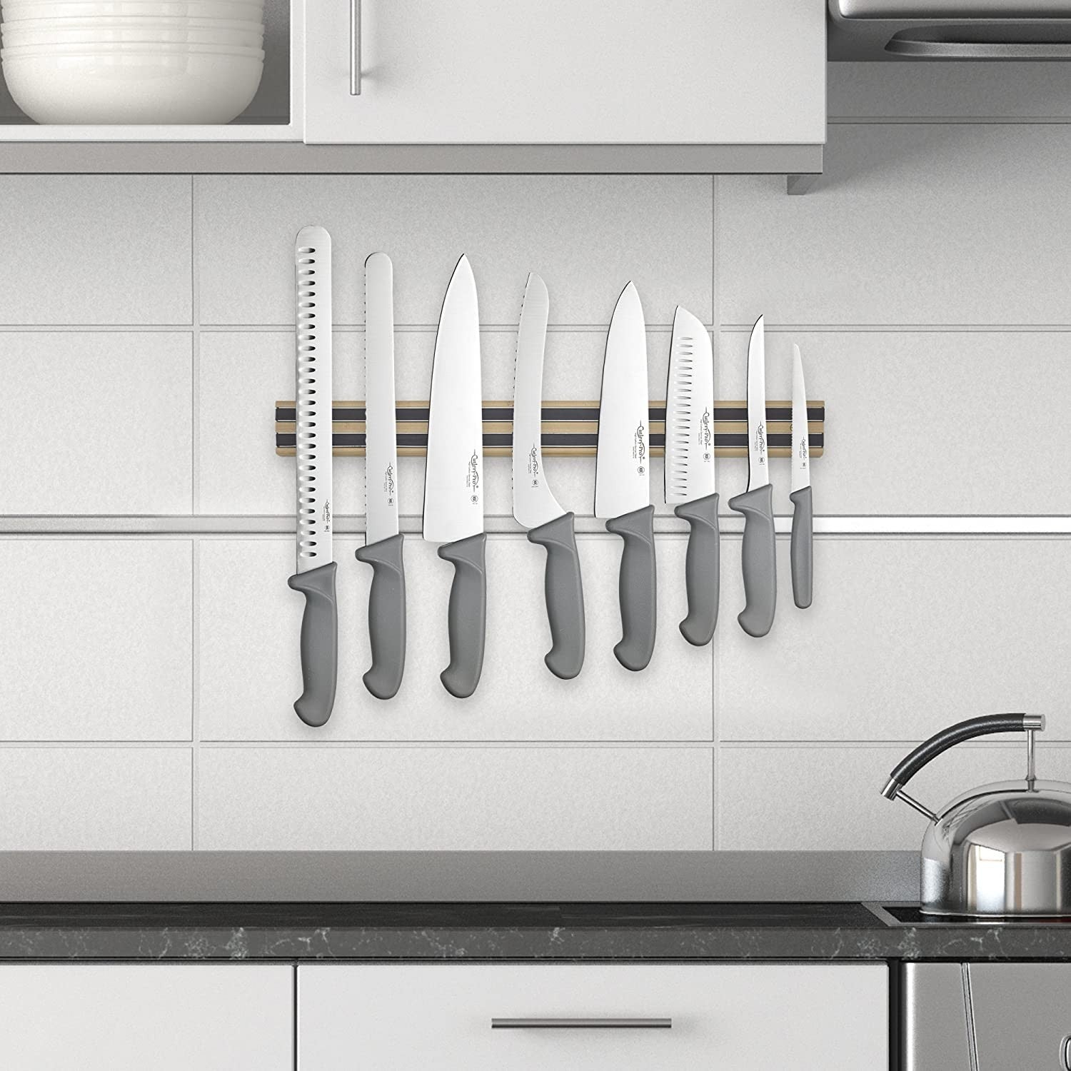 18-inch magnetic strip holding multiple kitchen knives with gray handles for kitchen gadgets and utensils organization