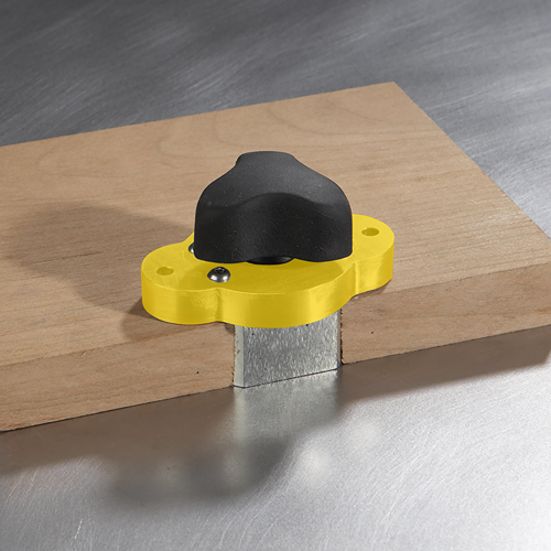 Yellow magnetic jig clamp with black ergonomic knob for securing wood on steel surfaces in tool accessories collection