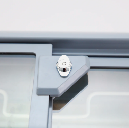 Close-up of lock mechanism on commercial glass top freezer in Appliances and Refrigerators collections