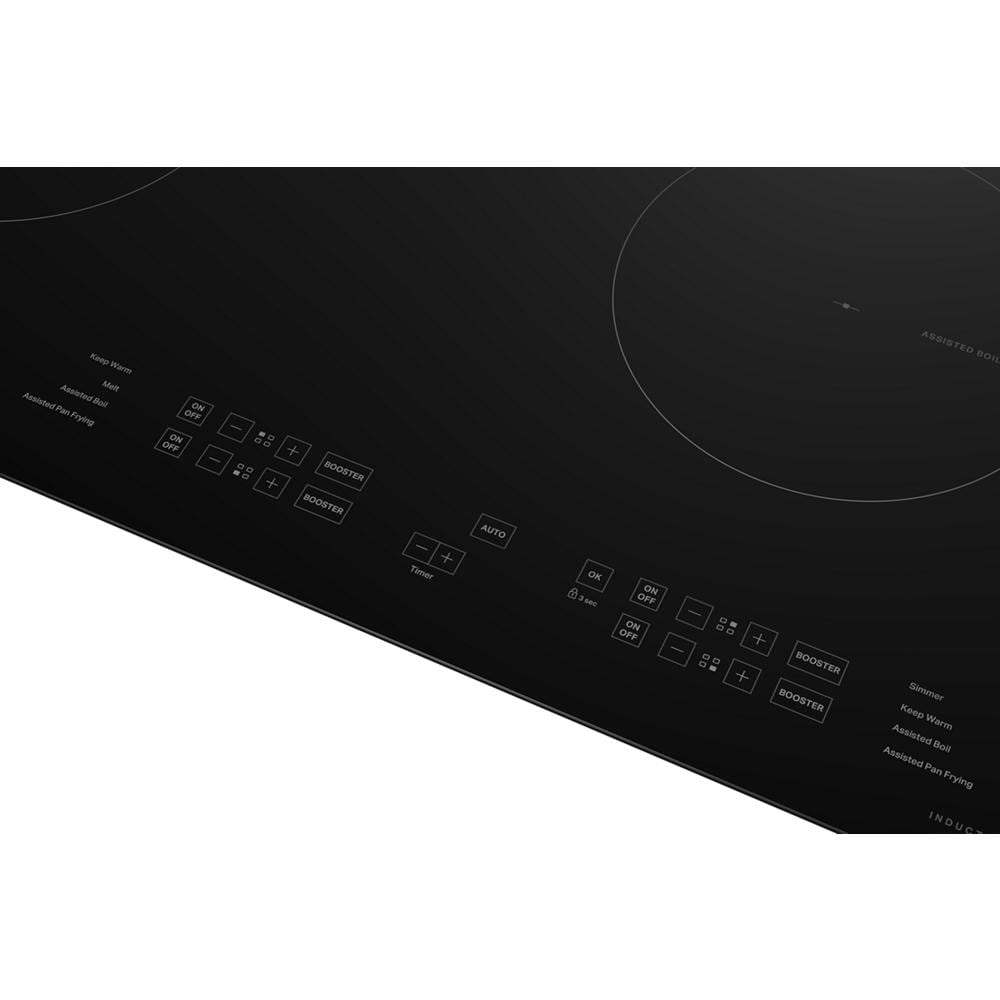 Black induction cooktop with four cooking zones and touch controls, featuring WipeClean™ coating from kitchen appliances.