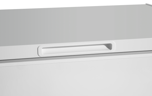 Close-up of white chest freezer lid with integrated handle in kitchen and home appliances setting
