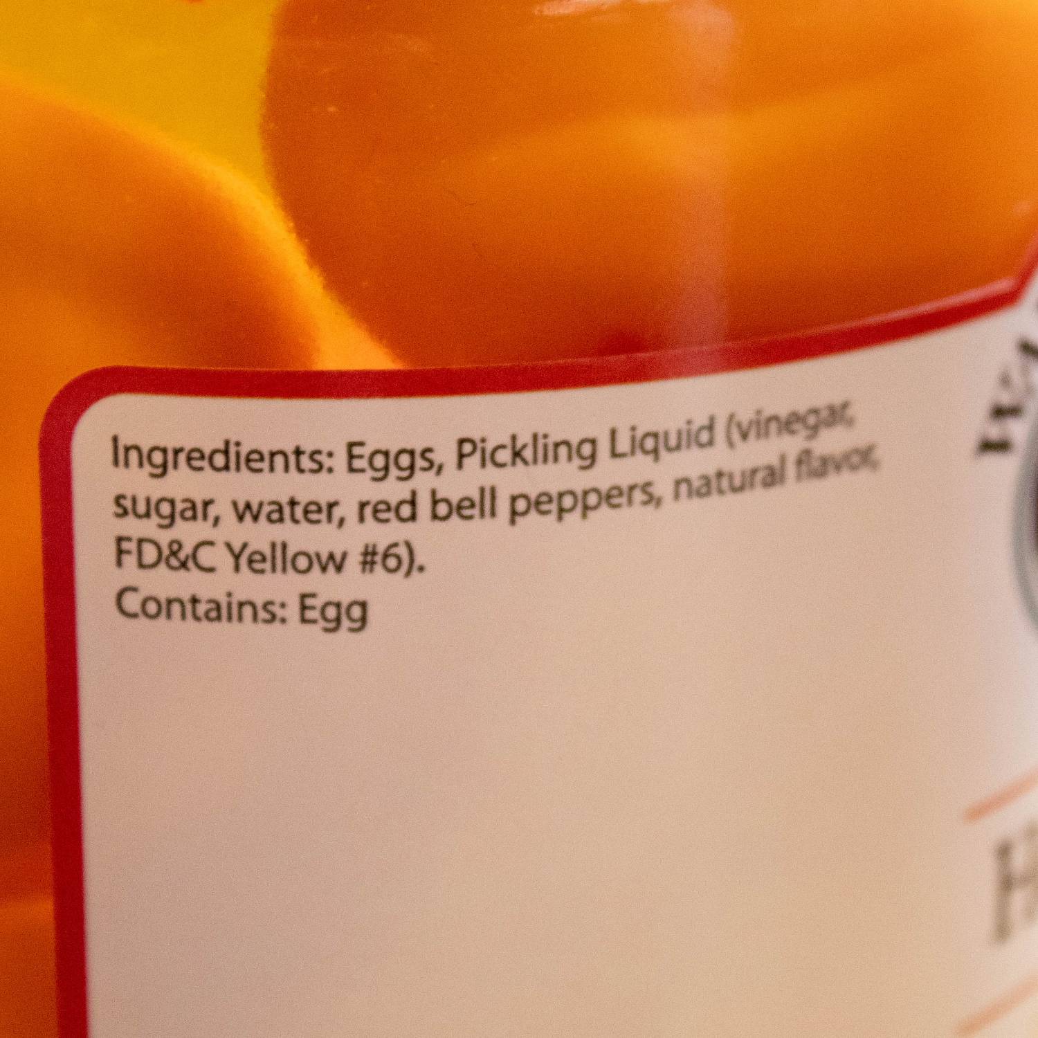 Close-up of ingredient label on jar of Walnut Creek hot pickled eggs for Fruits & Vegetables under $50 collection