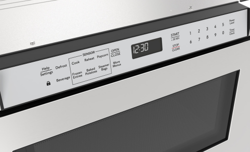 Close-up of stainless steel microwave drawer control panel with digital clock and sensor cooking options in Microwaves collection