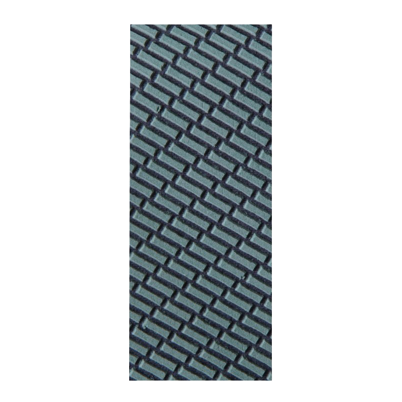 Close-up of textured abrasive surface with gray and black patterned grit for tool sharpening and home improvement use