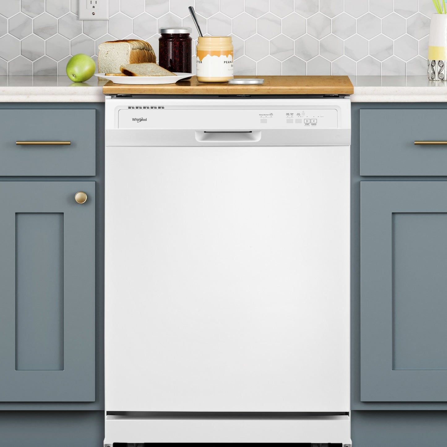White heavy-duty built-in dishwasher with control panel in modern kitchen with blue cabinetry and wood countertop