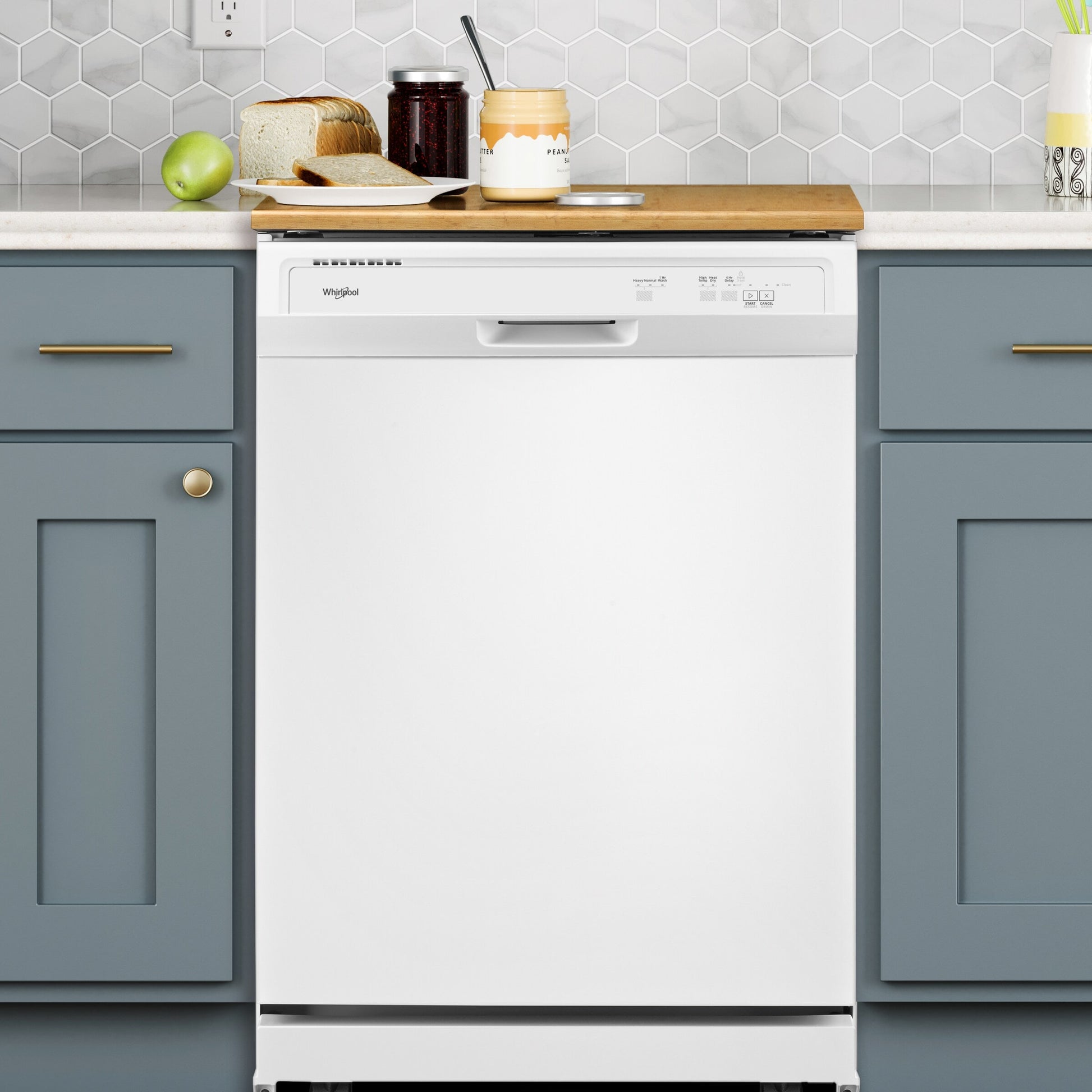 White heavy-duty built-in dishwasher with control panel in modern kitchen with blue cabinetry and wood countertop