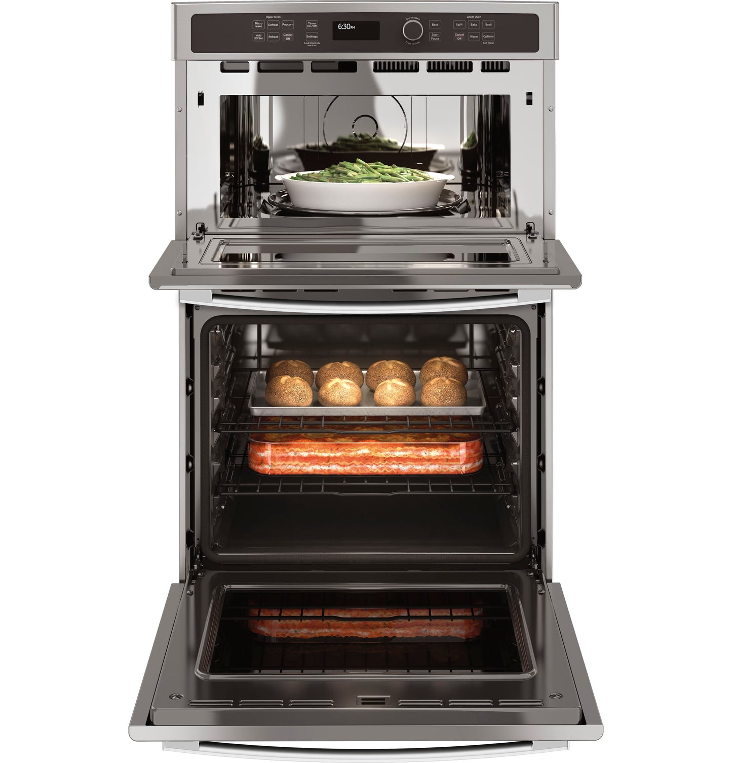 Open combination microwave and thermal wall oven with food cooking inside in a modern kitchen appliance setting