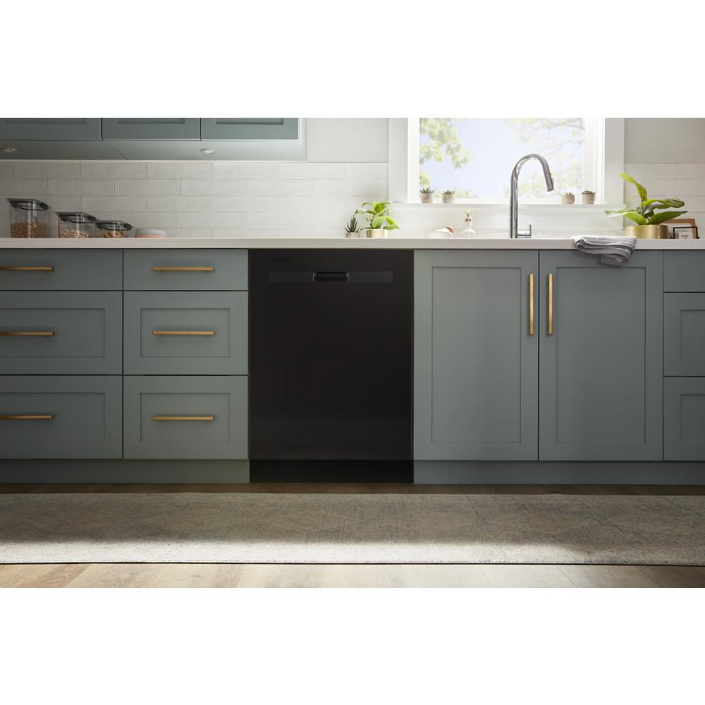 Black built-in dishwasher integrated into modern kitchen cabinetry with gold hardware in appliances collection