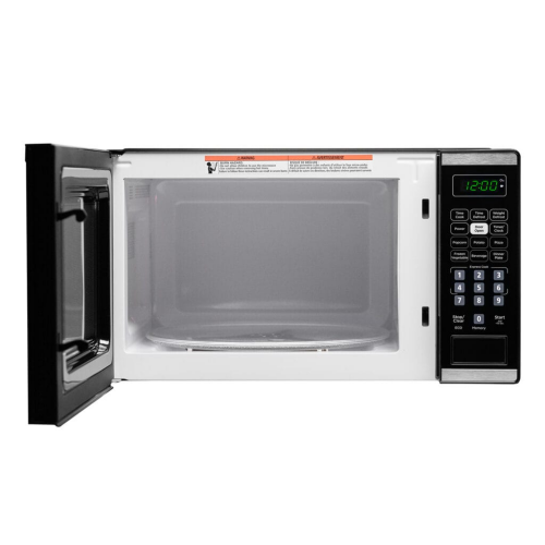 Open black countertop microwave with interior turntable and digital control panel showing 12:00 timer in kitchenware collection