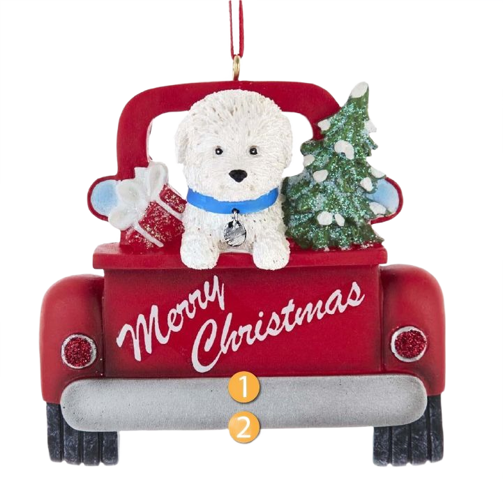 White Bichon Frise dog with blue collar in red truck holding Christmas tree and gifts ornament for holiday décor