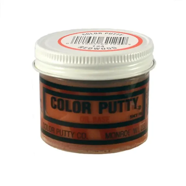 Small jar of redwood oil-based wood filler for patching and repair in home improvement projects