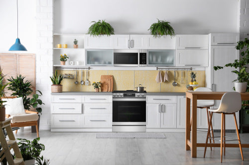 Modern kitchen featuring a black glass and stainless steel 30-inch gas slide-in range with convection and AirFry features