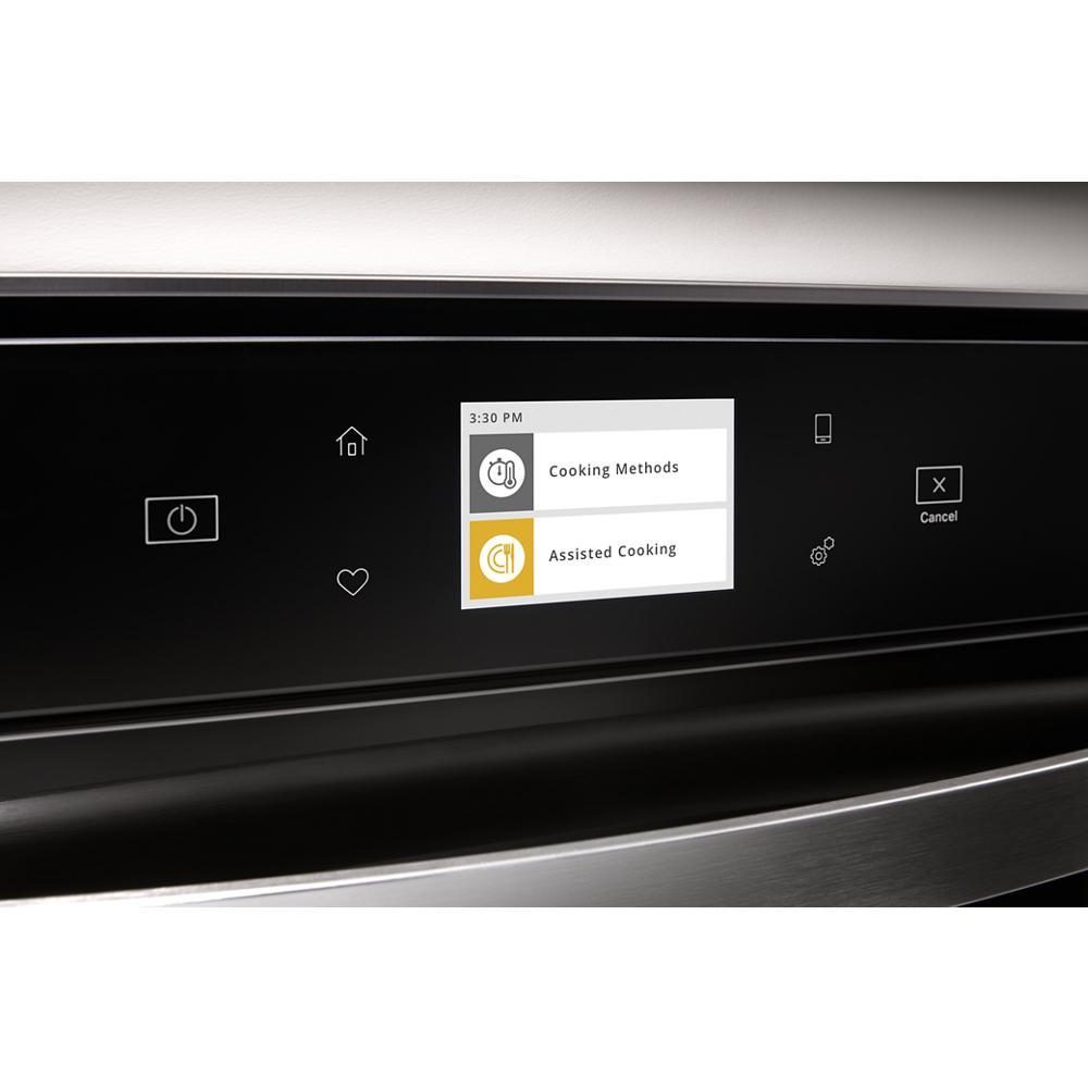 Touchscreen control panel on stainless steel double wall oven displaying cooking options in kitchen appliances collection