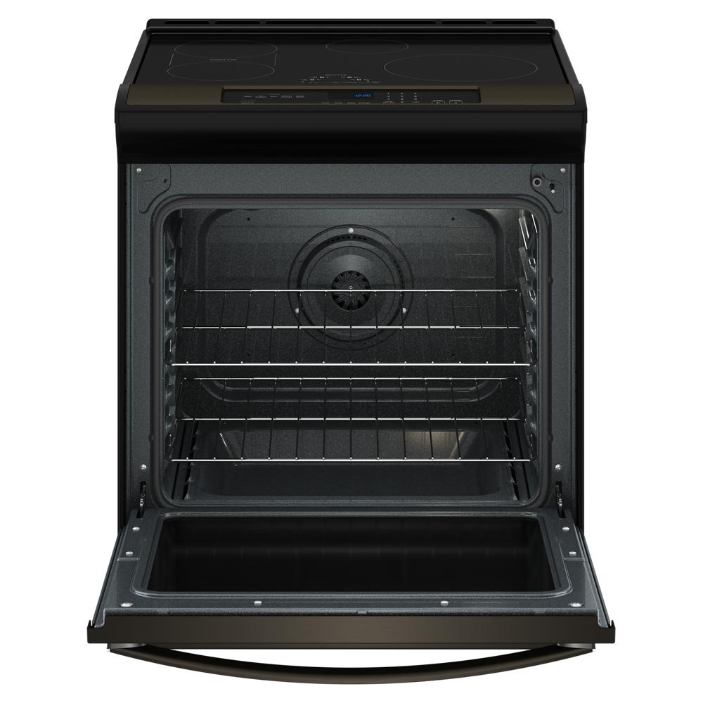 Black 30-inch induction range with open oven door showing multiple wire racks and smooth cooktop controls panel