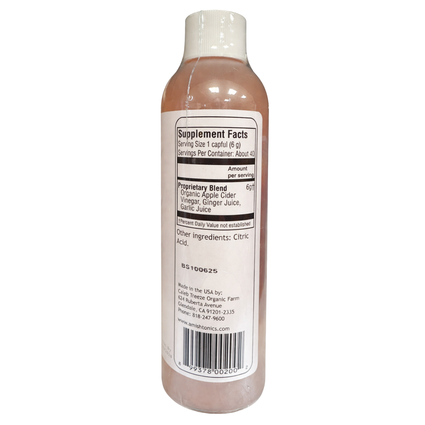 Bottle label showing supplement facts and organic ingredients including apple cider vinegar, ginger, and garlic juice in health and beauty product.
