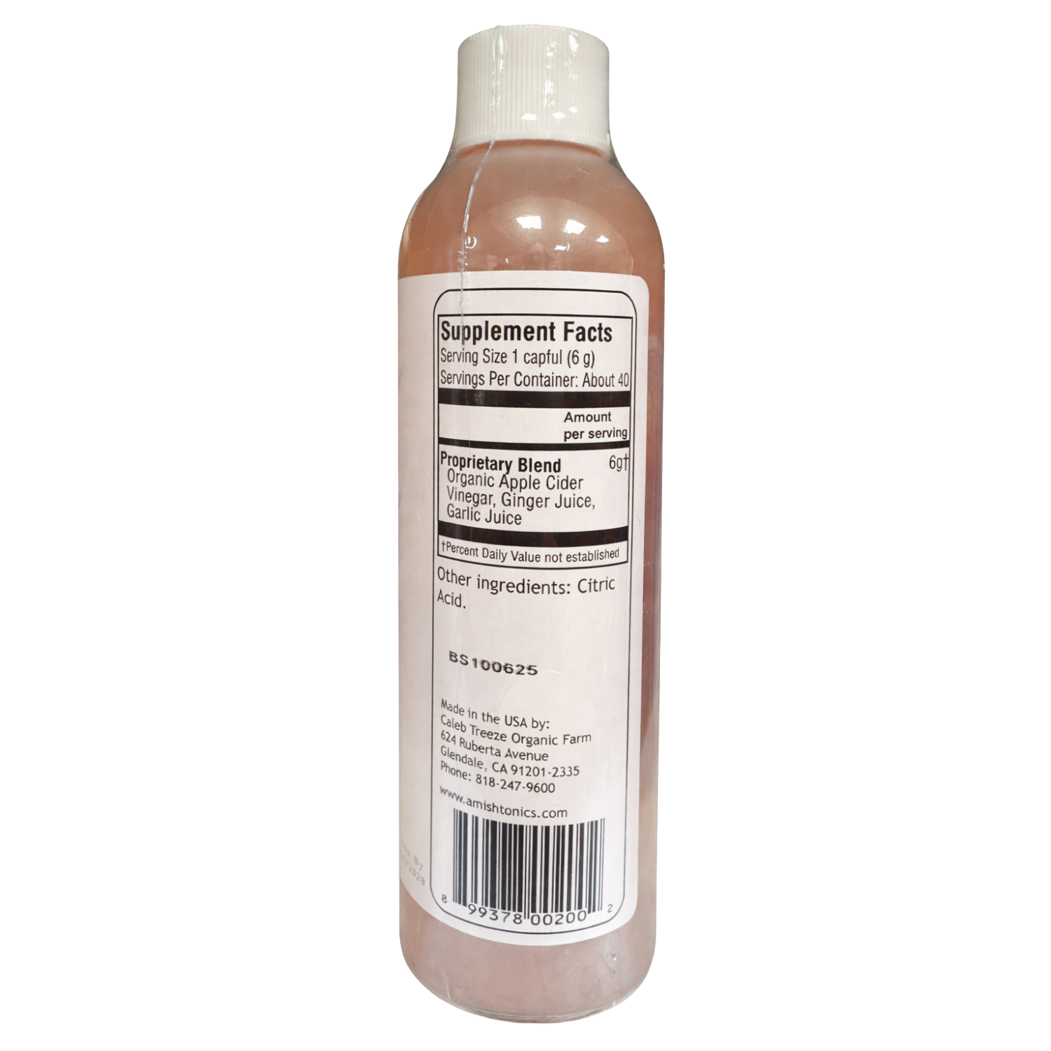 Bottle label showing supplement facts and organic ingredients including apple cider vinegar, ginger, and garlic juice in health and beauty product.