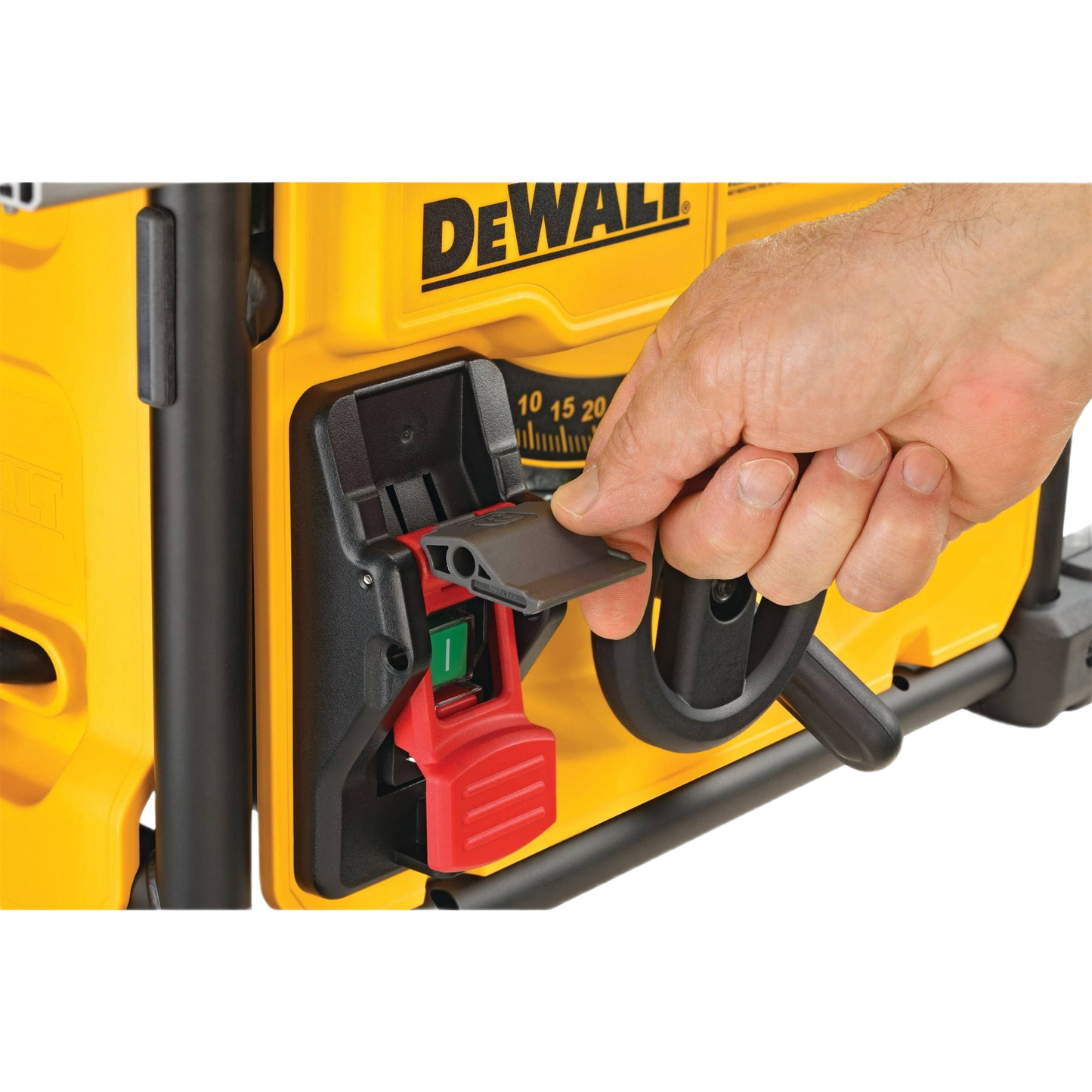 Hand adjusting power switch cover on yellow DEWALT jobsite table saw for woodworking and home improvement tools collections