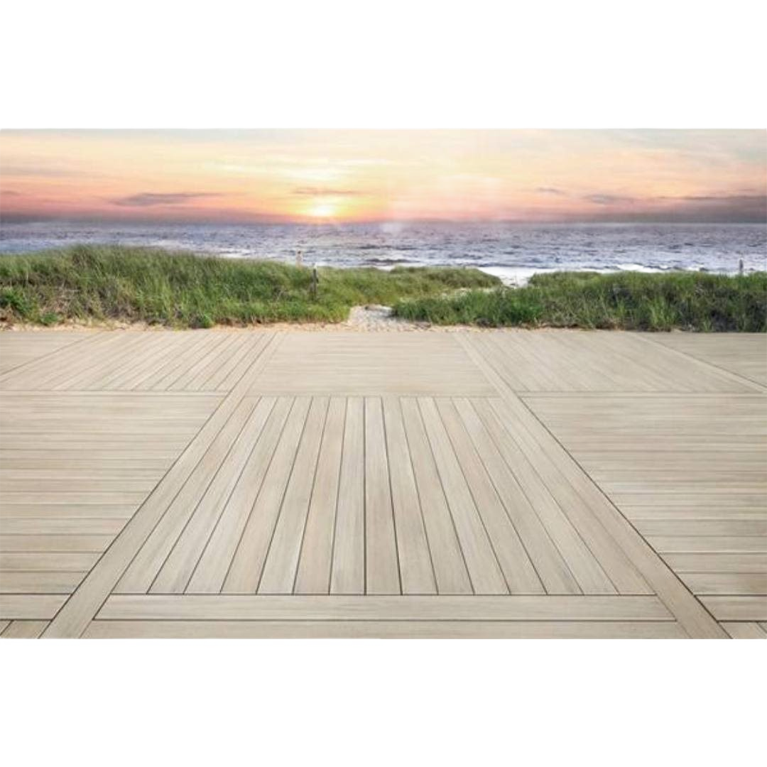 Outdoor grooved deck boards with French white oak finish arranged in a modern pattern by the ocean at sunset