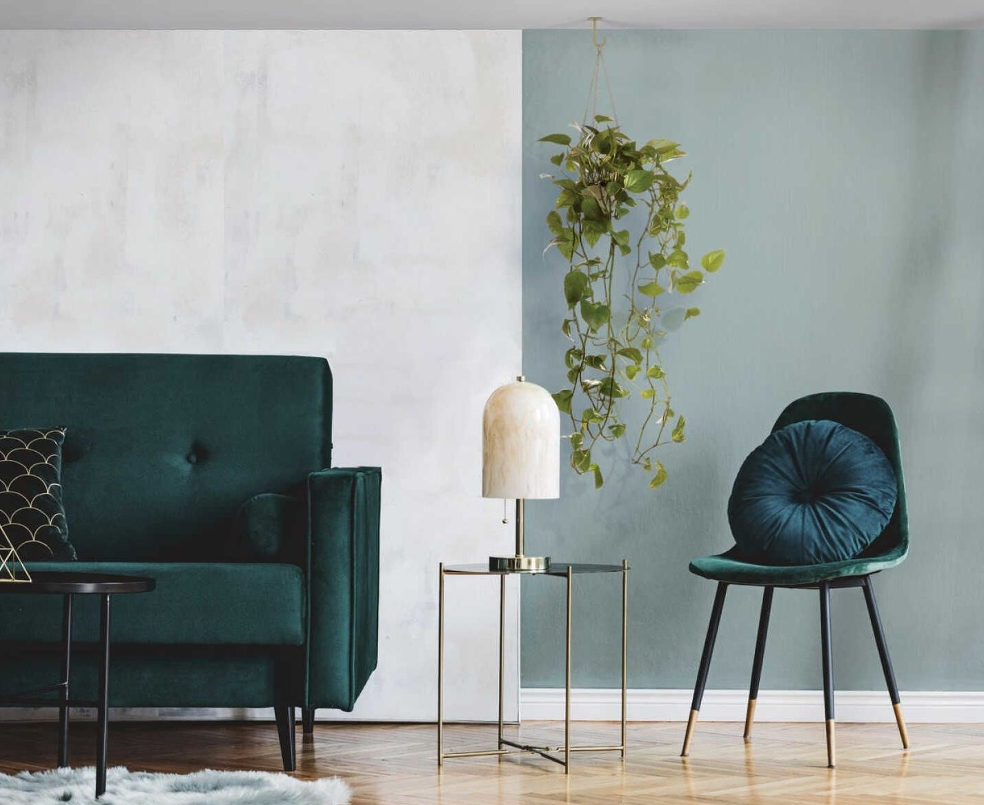 Brushed gold steel long ceiling hook suspending a trailing green plant in a modern living room setting under $50 collection
