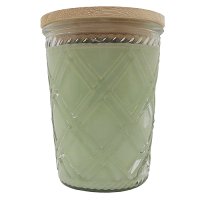 Green scented candle in textured glass jar with wooden lid for home ambiance and decor