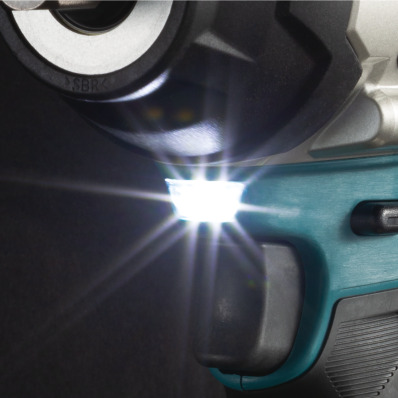 Bright LED light illuminating work area on teal cordless impact wrench for home improvement tasks
