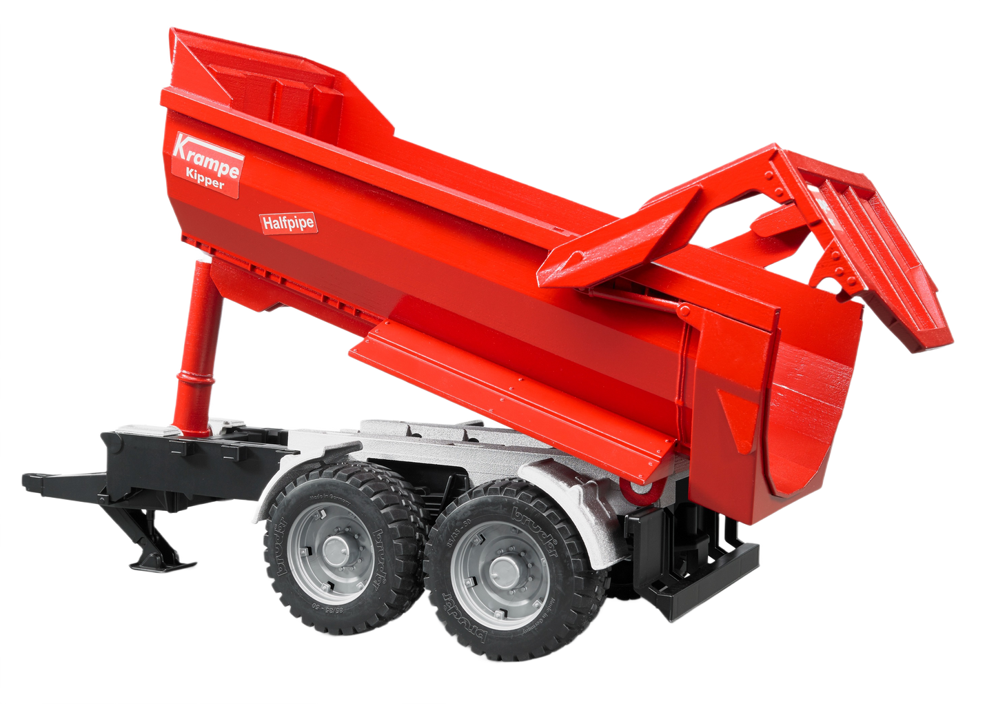 Red tandem axle halfpipe tipping trailer model with detailed wheels and black chassis for realistic play or display